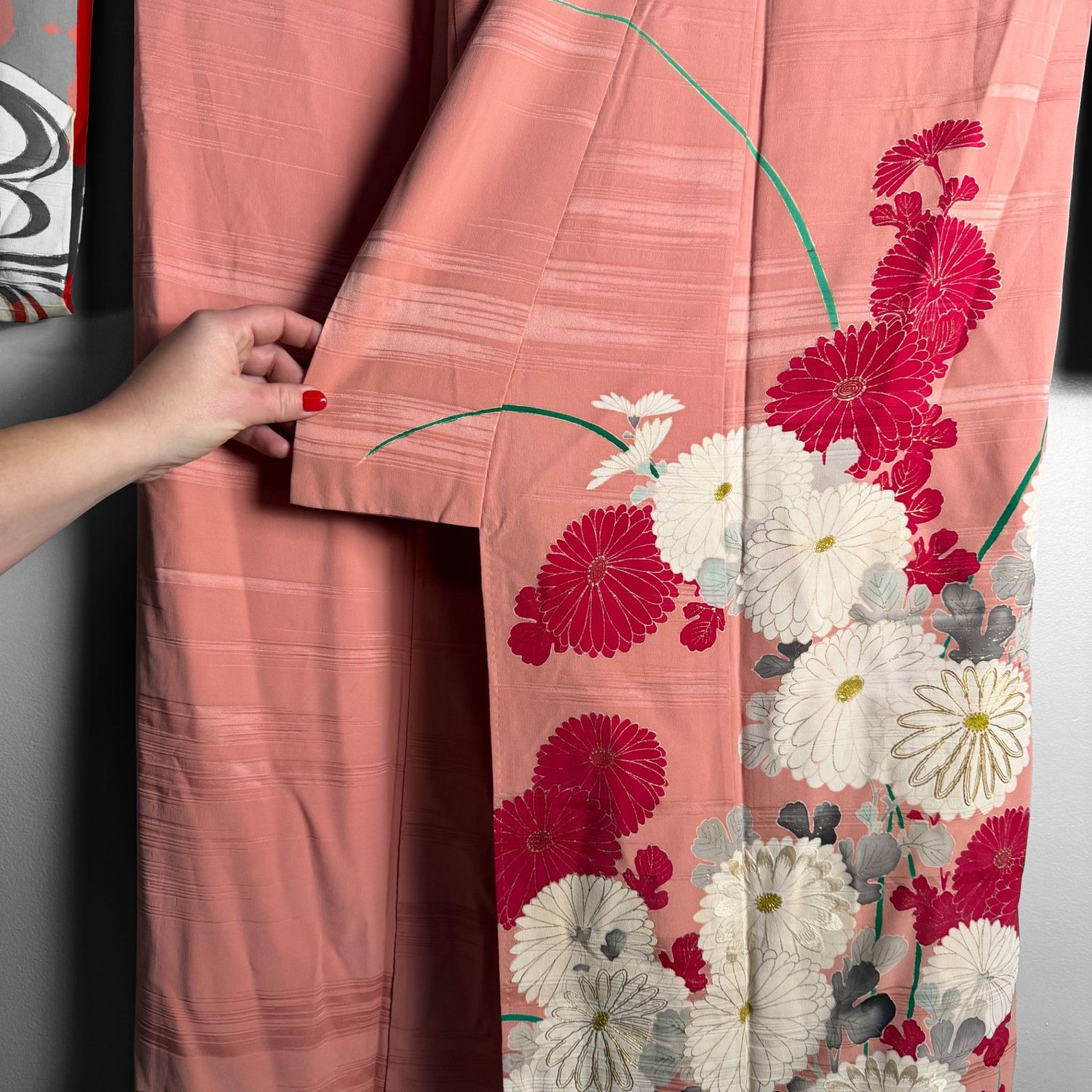 Salmon-pink Japanese silk kimono with chrysanthemums and embroidered accents, 1950s.