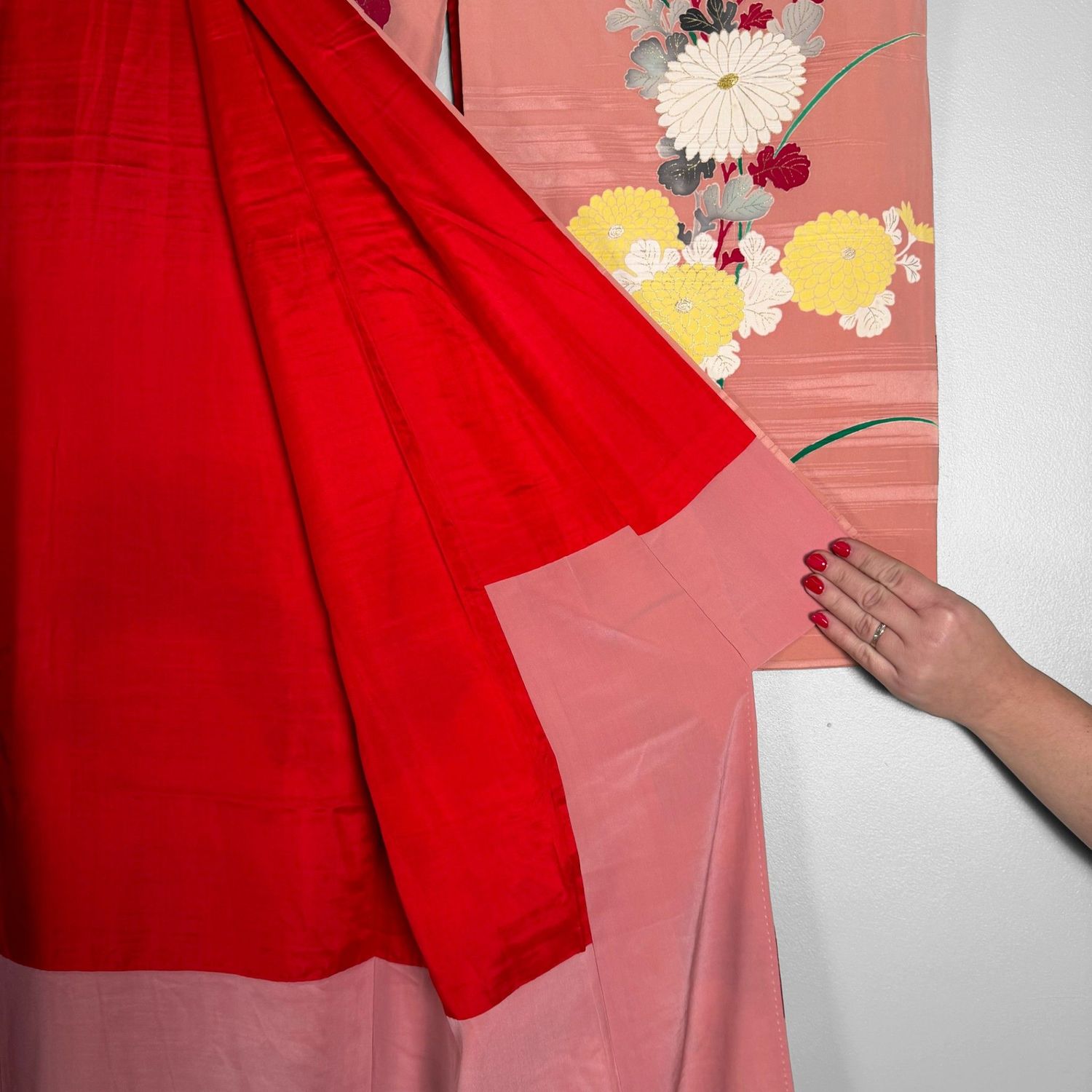 Salmon-pink Japanese silk kimono with chrysanthemums and embroidered accents, 1950s.