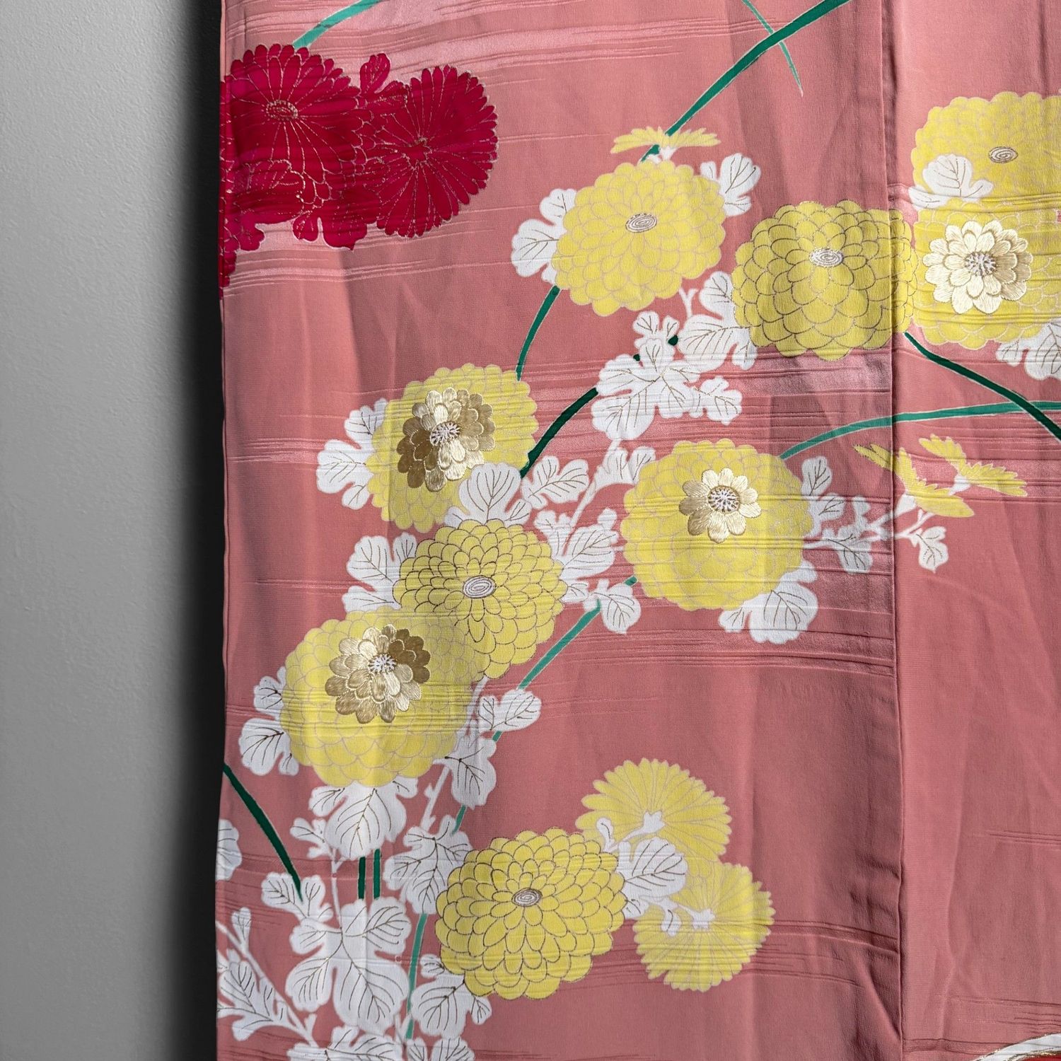 Salmon-pink Japanese silk kimono with chrysanthemums and embroidered accents, 1950s.