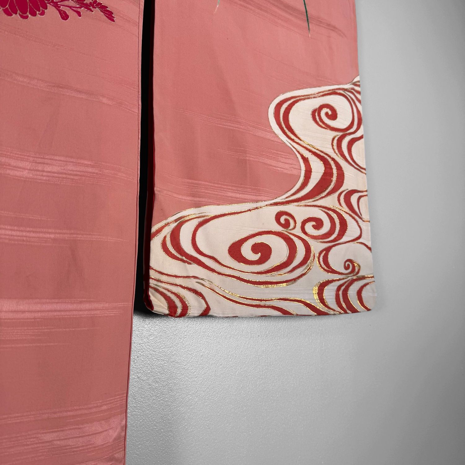 Salmon-pink Japanese silk kimono with chrysanthemums and embroidered accents, 1950s.