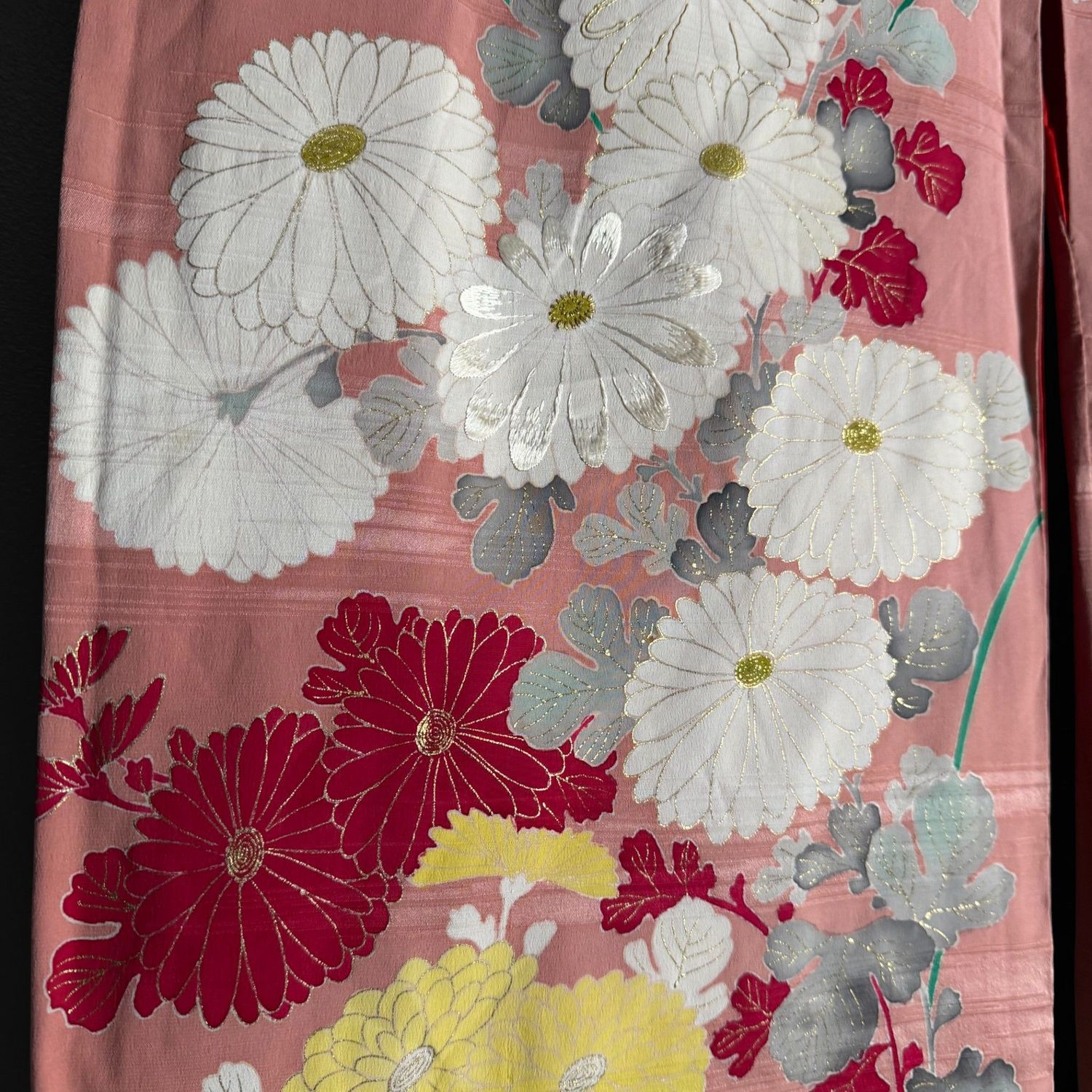 Salmon-pink Japanese silk kimono with chrysanthemums and embroidered accents, 1950s.