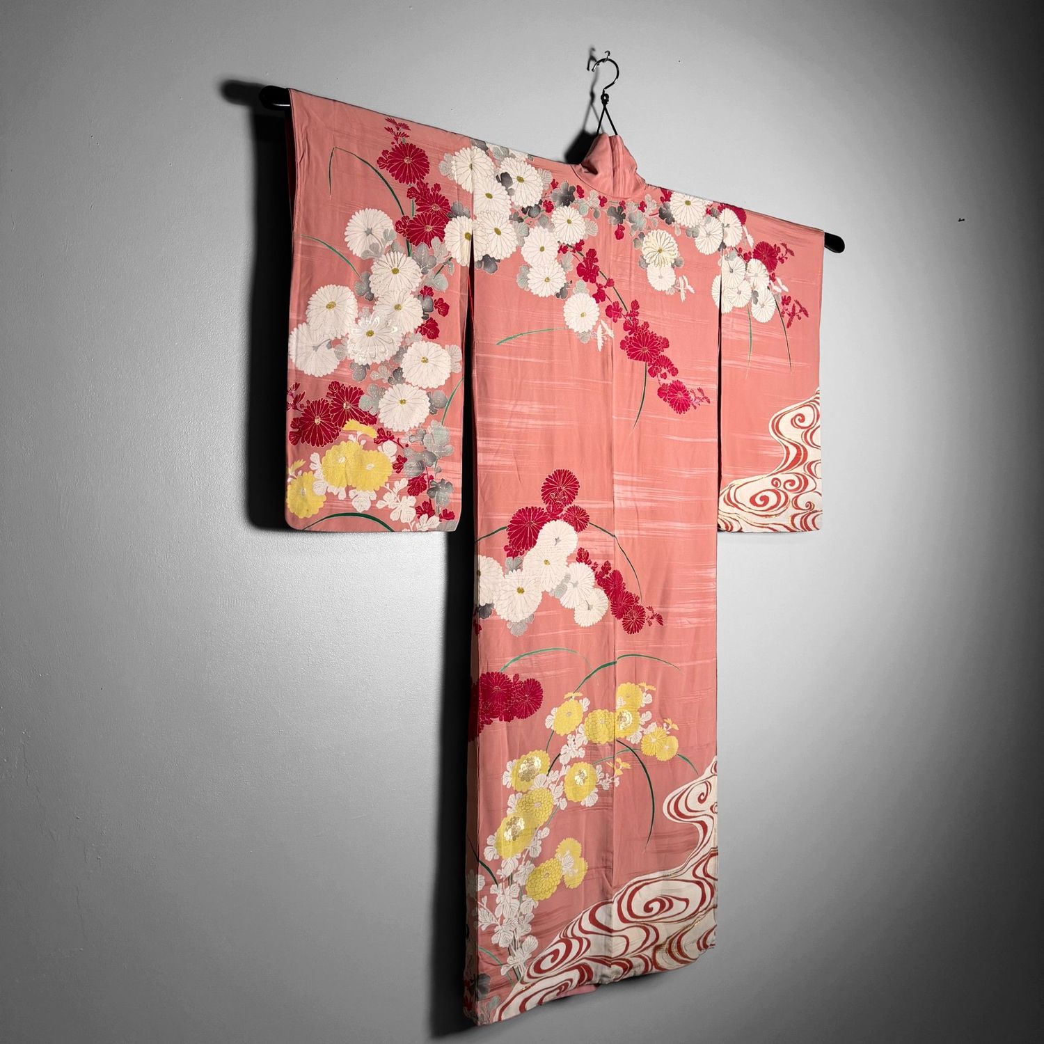 Salmon-pink Japanese silk kimono with chrysanthemums and embroidered accents, 1950s.