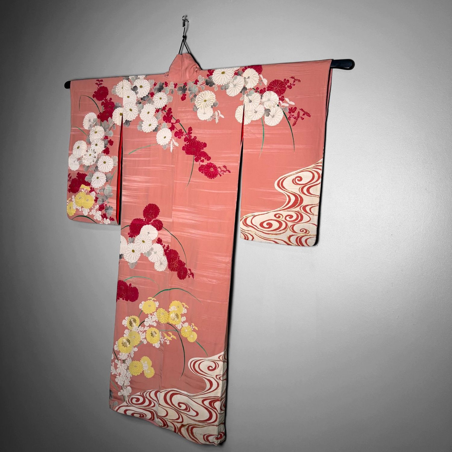 Salmon-pink Japanese silk kimono with chrysanthemums and embroidered accents, 1950s.