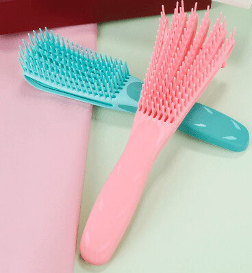Brosse-peigne démêlante cheveux bouclés et afro
