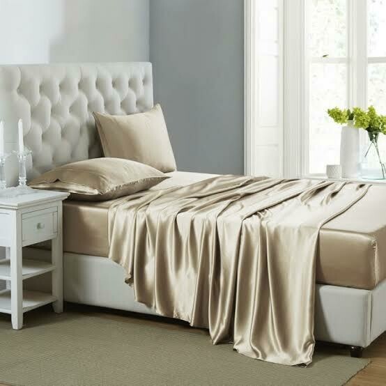 Cream colored silk bedsheets