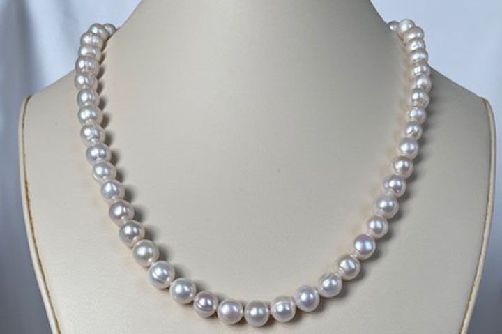 White pearl necklace with heart toggle clasp