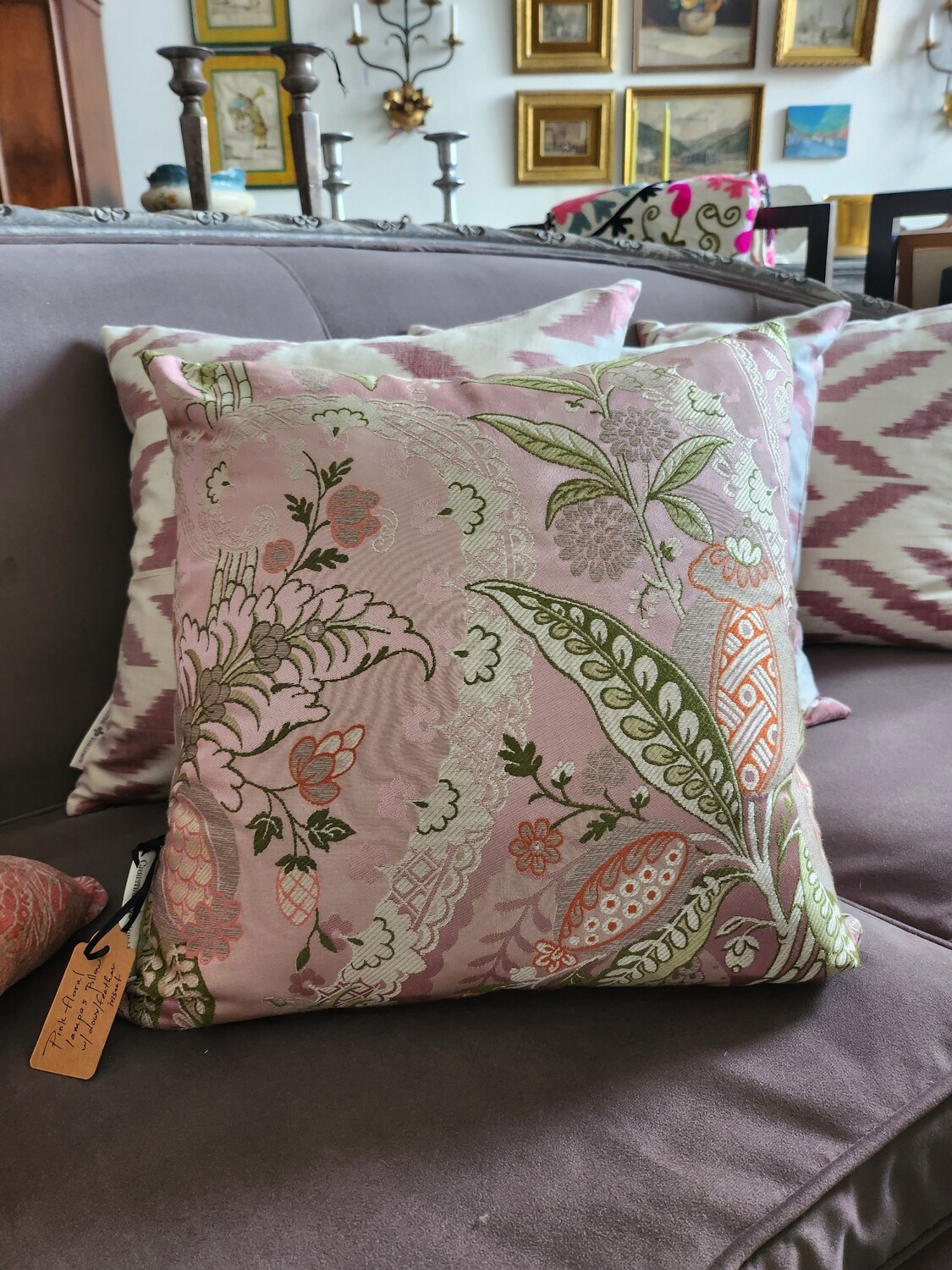 Multi colored silk lampas pillow, mostly pale pinks, green and silver.