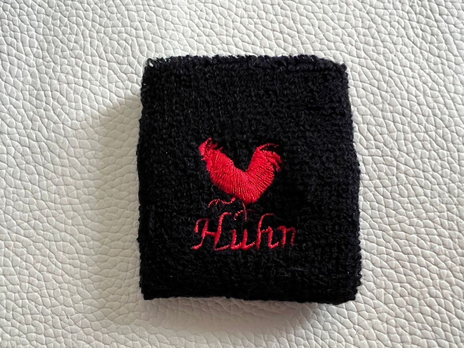 Handgelenk Schweißband - schwarz mit rotem Huhn