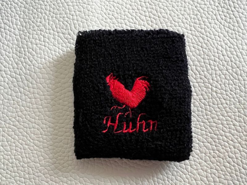 Handgelenk Schweißband - schwarz mit rotem Huhn