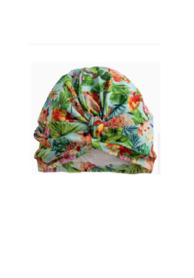 Tropical Flamingo Splash Cap & Shower Turban. Front view showing gathered material. Flamingos and tropical plants on a pale blue background.