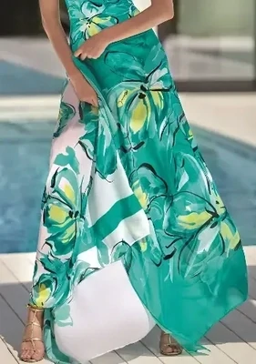 Roidal Bali Patricia Pareo. The fabric features a vibrant mix of a turquoise blue/green shade, and a white background scattered with large tropical flowers.