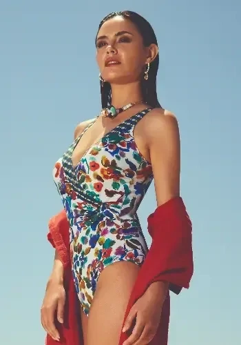 Eda Crossover Swimsuit by Nuria Ferrer, Crossover style swimsuit in a floral print. Lifestyle photo.