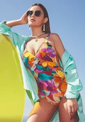 Malena Shaper Swimsuit by Nuria Ferrer. Swimsuit in a colourful modern abstract print. Lifestyle photo.