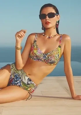 Palm Adjustable Bikini by Nuria Ferrer. This nderwired bikini comes in a bright multi-coloured abstract print. The bikini pants have corded side-ties which give the ability to vary the coverage over the lower tummy and hip area. Lifestyle print.