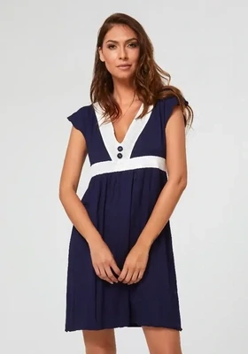 Nuria Ferrer Pitusa Sun Dress. Navy blue beach cover up with white trim. Front view.
