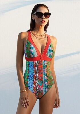 Ceylan Caribbean Swimsuit. The fabric is a colourful tropical print. Lifestyle photo.