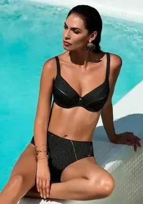 Nuria Ferrer Lina Bikini in a black fabric with a gold pinstripe. Lifestyle photo.