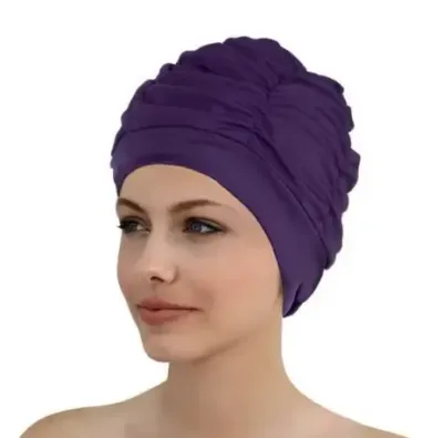 Purple Ruched Swim Turban by Fashy, shown being worn by model.