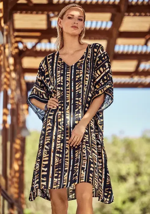 Caramel Stripe Tunic Dress  by Charmline. The fabric is a stylised abstract animal and stripe print, in black and a delicious soft caramel shade. Lifestyle photo.