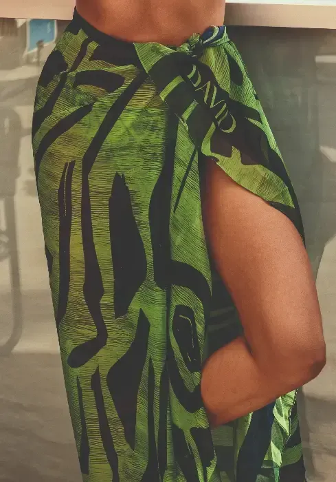 Lifestyle photo of  the Dave Primitive Soul sarong wrap in an unusual green and black colour combination