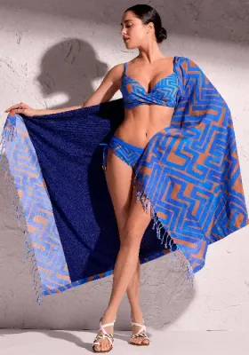 David Swimwear Freedom beach towel in a modern abstract  copper brown print on a blue background 