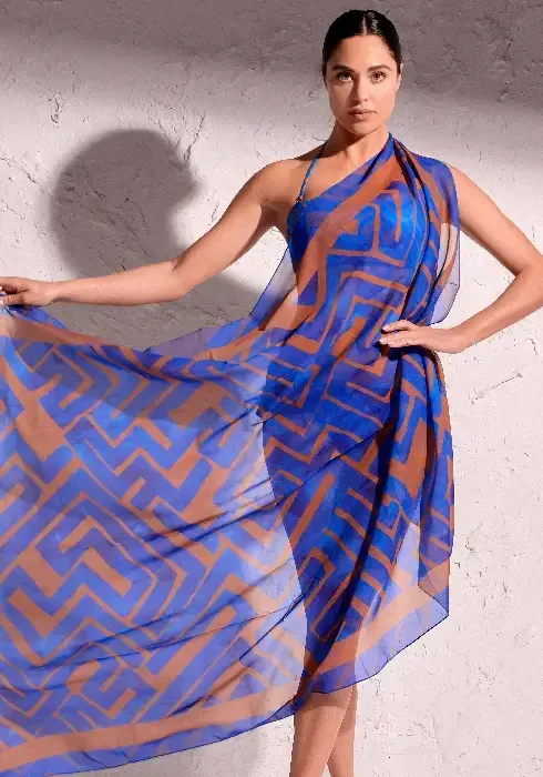 Front view David Freedom Sarong. A copper abstract print on a blue background.
