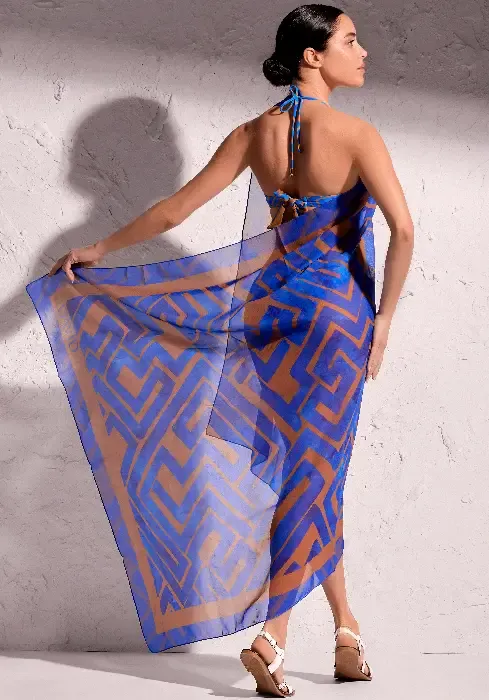 Front view David Freedom Sarong. A copper abstract print on a blue background.
