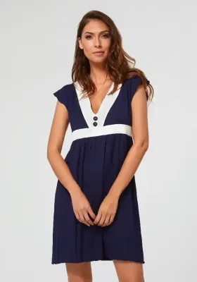 Pitusa Sun Dress Nuria Ferrer Pitusa Sun Dress. Navy blue beach cover up with white trim. Front view.