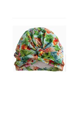 Tropical Flamingo Splash Cap & Shower Turban Tropical Flamingo Splash Cap & Shower Turban. Front view showing gathered material. Flamingos and tropical plants on a pale blue background.