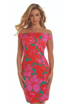 Roidal Floreale Alida Complice Dress. The fabric is a print of up-scaled blooms in bright pink and red with contrasting little flashes of emerald green.  The hemline falls just above the knee. Golden tipped drawstrings at the shoulder can give a rise or fall effect, so the dress can be worn on or slightly off the shoulder