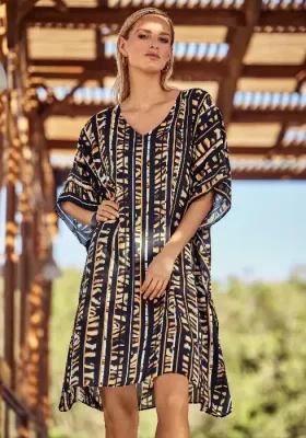 Caramel Stripe Tunic Dress  by Charmline. The fabric is a stylised abstract animal and stripe print, in black and a delicious soft caramel shade. Lifestyle photo.