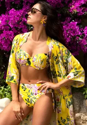Lise Charmel Jardin Delice Shirt Sun Dress in a floral pattern on a yellow background. Lifestyle photo.