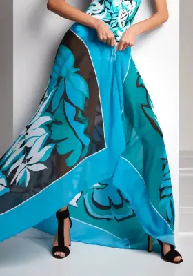 Roidal Amazonia Opal Pareo. The fabric Amazonia print is of flowing green and blue waves with small flashes of black, plus white fronds scattered across the background.