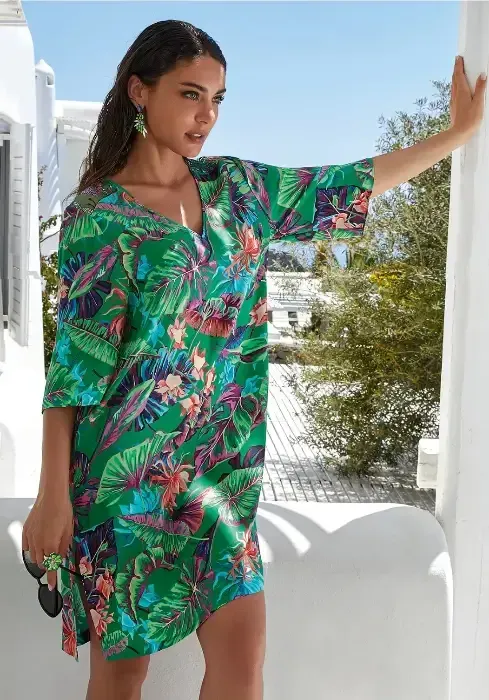 Paradis Sauvage Kaftan Tunic  by Lise Charmel in a Green floral fabric. Lifestyle photo