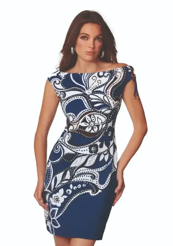 Roidal Cachemire Doria Complice Dress. Blue and White Paisley fabric. The dress falls just above the knee.  Golden tipped drawstrings at the shoulder can give a rise or fall effect. The dress can be worn on or slightly off the shoulder