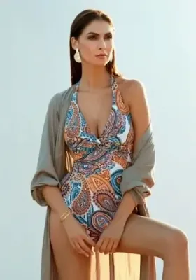Venus Halterneck Swimsuit by Nuria Ferrer. A halterneck swimsuit in a paisley print. Lifestyle photo.