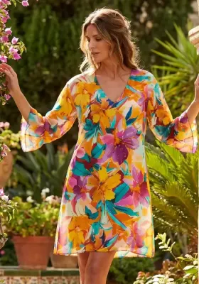 Malena Sundress by Nuria Ferrer. The hem falls at knee length and the abstract floral print looks great. Lifestyle photo.