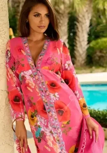 Copacabana Maxi Kaftan Dress Copacabana Maxi Kaftan Dress, a maxi length pink floral print beach cover up. Lifestyle photo.