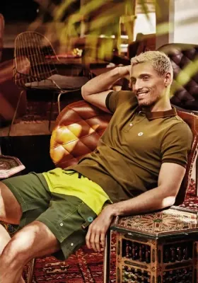 Lifestyle photo of David Italia Mare Atlantis Cargo Swim Shorts. The design is 2 shades of green and side pockets.