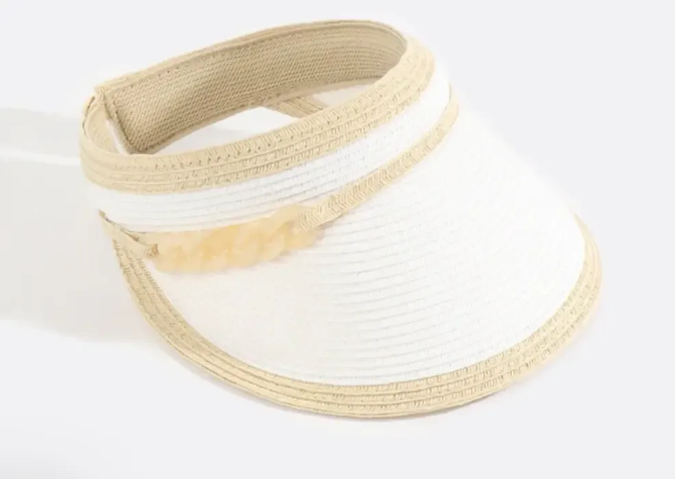 Lifestyle photo of Cassini Visor in white with natural coloured trim and gold links to the side.