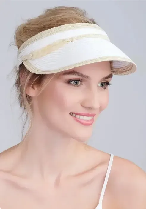 Lifestyle photo of Cassini Visor in white with natural coloured trim and gold links to the side.