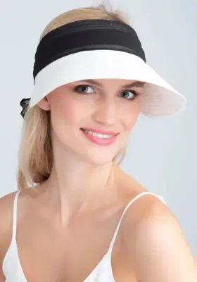 lifestyle photo of Augusta Visor in White & Black a white visor with black material bow