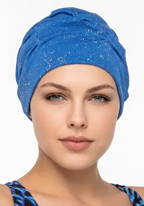 A model in a studio setting wearing a Fashy Blue Silver Glimmer Swim Turban