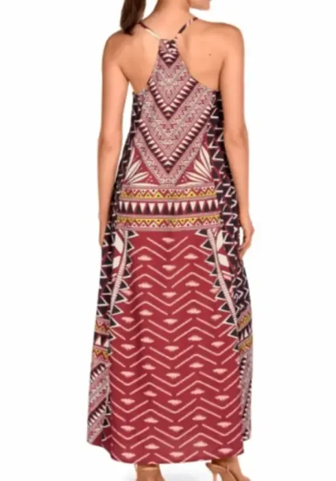 A model wearing a Geometric Racer-back Maxi Dress by Dolores Cortés. Adjustable spaghetti straps, loose comfortable fit.
