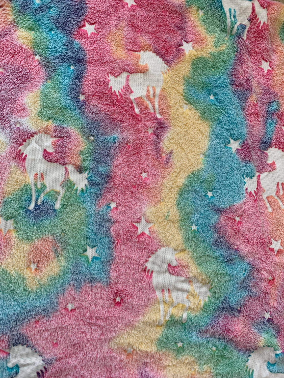 Tissu phosphorescent Licorne multicolore