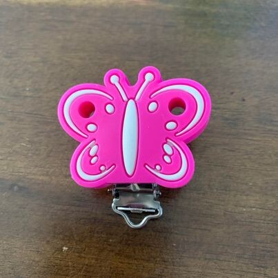 Attache suce papillon