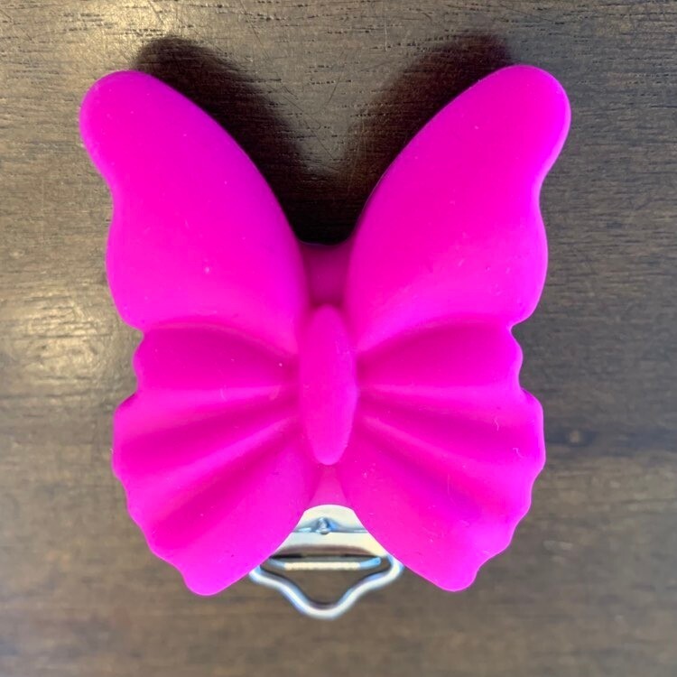 Attache suce papillon, couleur: rose