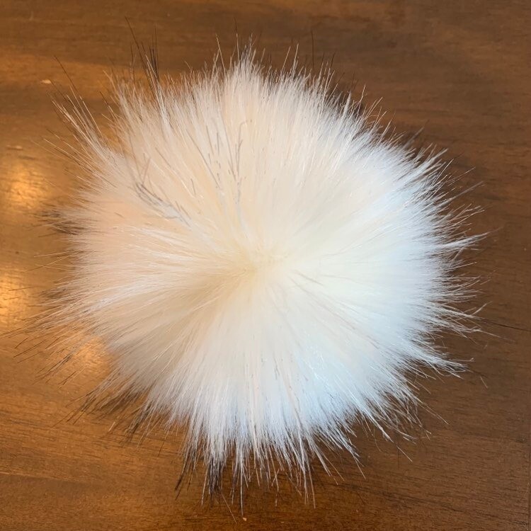 Pompon fausse fourrure de raton laveur blanc et noir