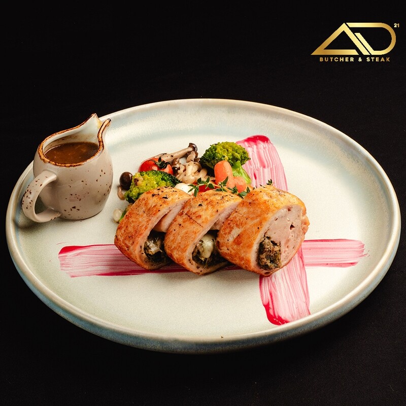 Creamy Chicken Roulade with Sautéed Spinach and Mushrooms