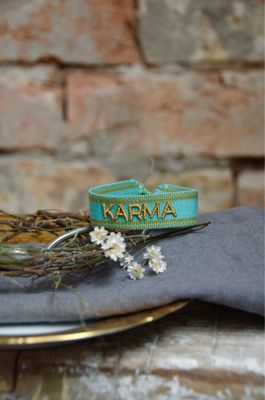 „Karma“ gewebtes Armband in mintgrün und gold